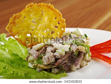 Tasty salad of beef tongue with vegetable