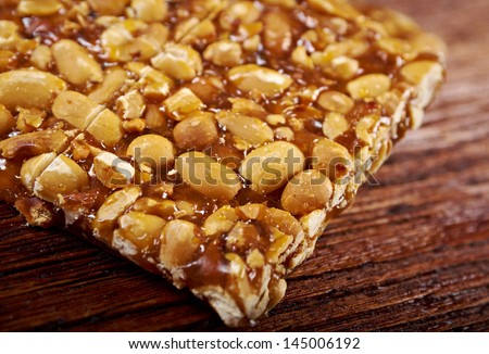 Peanut brittle sweet hard on wooden table