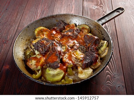 Beef Ragout with wine sauce and  vegetables on french.farm-style
