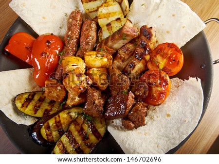 Shashlik (shish kebab). Various types  mat roasted with vegetable closeup