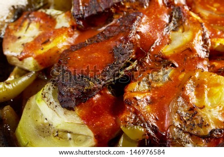 Beef Ragout with wine sauce and  vegetables on pan on french farm-style