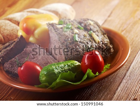 roast beef farm-style  with vegetable and bread .farmhouse kitchen