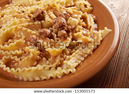 Italian pasta mafalde with  beef ,sour cream and  tomato sauce