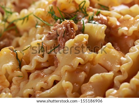 Italian pasta mafalde with  beef ,sour cream and  tomato sauce .Shallow dof