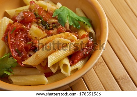 plate of penne rigata pasta with marinara sauce .farm-style