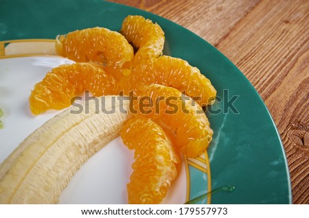 Kids Food.Fruit dessert for child with kiwi, banana and orange