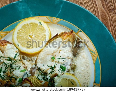 Halibut in Lemon Cream. served with lemon, fresh vegetables