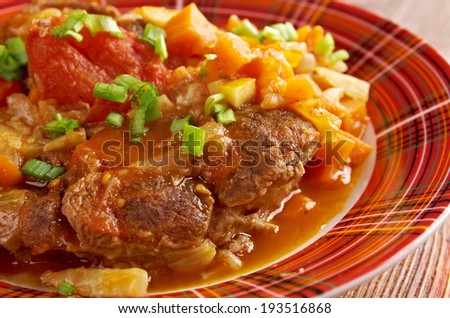 Ossobuco - Italiano country cuisine .Milanese specialty of cross-cut veal shanks braised with vegetables