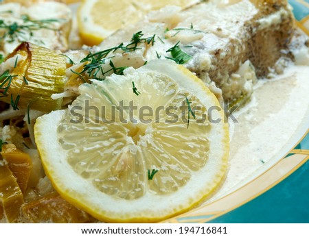 Halibut in Lemon Cream. served with lemon, fresh vegetables