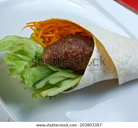 Breakfast burritos  made with beef rissole and vegetables