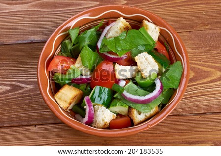 Panzanella or panmolle is a Tuscan salad of bread and tomatoes