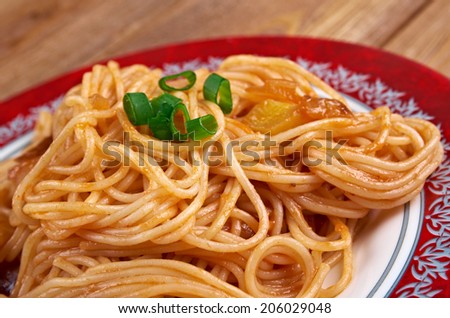 Pasta asciutta -   pastasciutta cooked pasta is plated and served with a complementary sauce or condiment