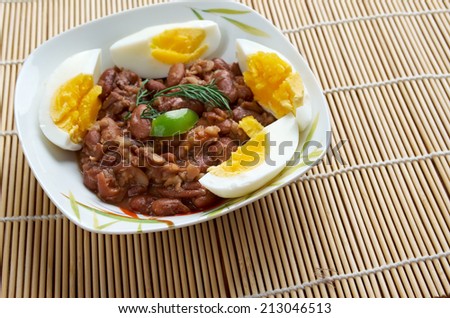 Ful medames - Egyptian,Sudanese dish of cooked and mashed fava beans served with vegetable oil,