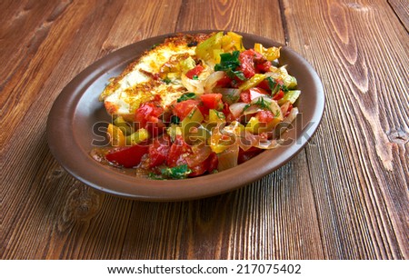 Egg in a hole is breakfast menu  with tomato and capsicum