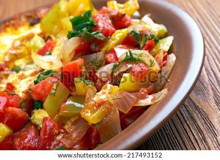 Egg in a hole is breakfast menu  with tomato and capsicum