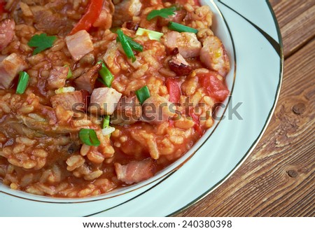 Charleston red rice - Savannah Red Rice  rice dish commonly  Southeastern coastal regions of Georgia and South Carolina.cooking  white rice with  tomatoes , bacon , pork sausage.