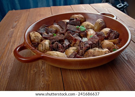 Afelia - a traditional Greek and  Cypriot food. pork marinated and cooked in red wine