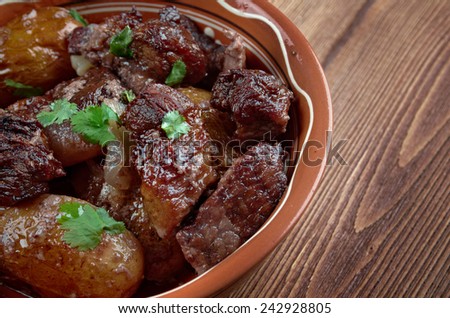 Afelia - a traditional Greek and  Cypriot food. pork marinated and cooked in red wine