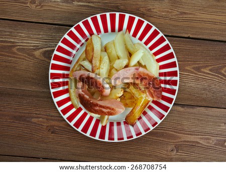 Salchipapas -  fast food dish , street food throughout Latin America.consist of thinly sliced pan-fried beef sausages and French fries