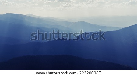 The sun\'s rays in the mountains at noon. Eastern Carpathians
