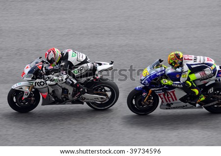 SEPANG, MALAYSIA - OCTOBER 25: Valentino Rossi and Gabor Talmacsi racing taken at MotoGP 2009 Shell Advance Malaysian Motorcycle Grand Prix on October 25, 2009 in Sepang, Malaysia.