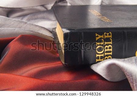 Black leather bible cover written with golden letters