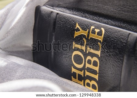 Black leather bible cover written with golden letters