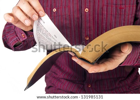 Man reading a Bible isolated on white