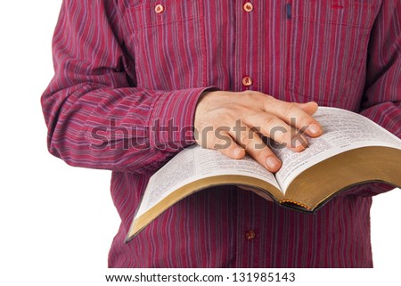 Man reading a Bible isolated on white