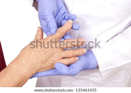 Senior woman with rheumatoid arthritis visit a doctor Isolated on white