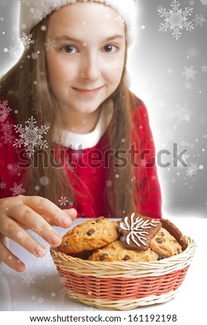 Beautiful Christmas girl wants to eat cookies