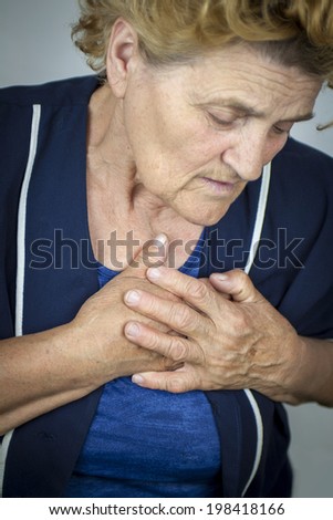Senior woman having chest pain. Heart attack