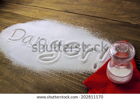 DANGER written on a heap of salt - Health Hazard
