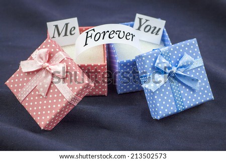 Presents boxes for female and male. Love message. Dark blue background