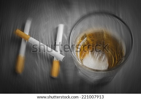 Blurry cigarettes and glass of alcohol forming the word NO on black and white background - Drunkenness - Health concept - Anti smoking and anti alcoholism campaign
