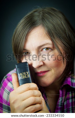 Adult Woman Reading a Bible. Close