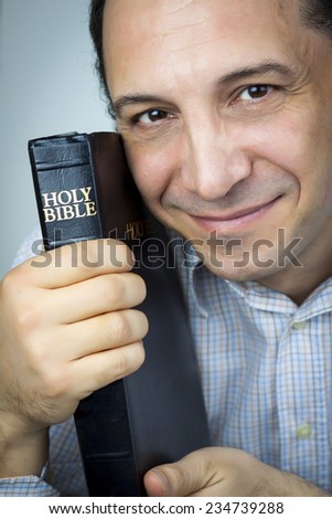 Portrait of a Man Holding Holy Bible