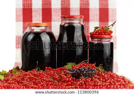 Home canning jars and harvest of red currant.