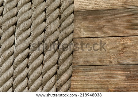 Hawser of vintage wood ship. Background of natural ropes.