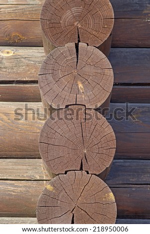 Joints of timber logs. Detail of traditional hardwood timber house.