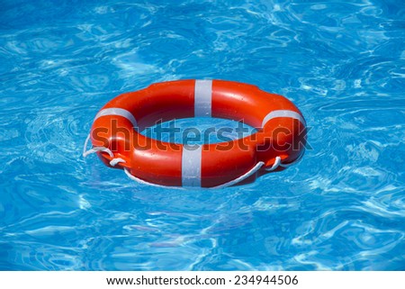 A buoy on the water in the pool is located in the center A buoy on the water in the pool