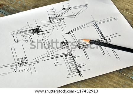 draft hand drawing foundation architecture plan on wood table