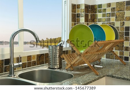 Kitchen Sink With Wooden Plate Rack In Asian Kitchen Style