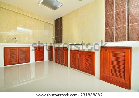 empty concrete counter kitchen with beige tile wall