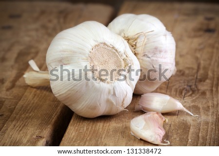 Organic Garlic Whole And Cloves On The Wooden Background
