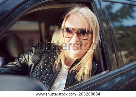 Car woman on road trip looking out of window