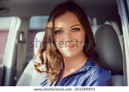 Car woman on road trip looking out of window
