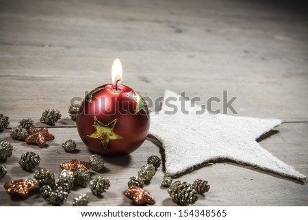 beautiful christmas decoration candle - on the wooden floor