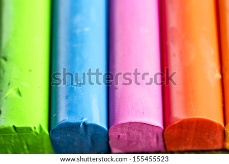 colors of play dough on the wooden table