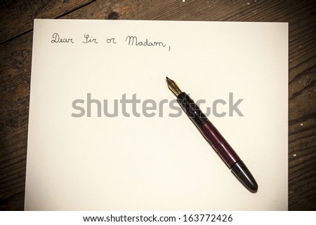 Old fashioned letter with a pen